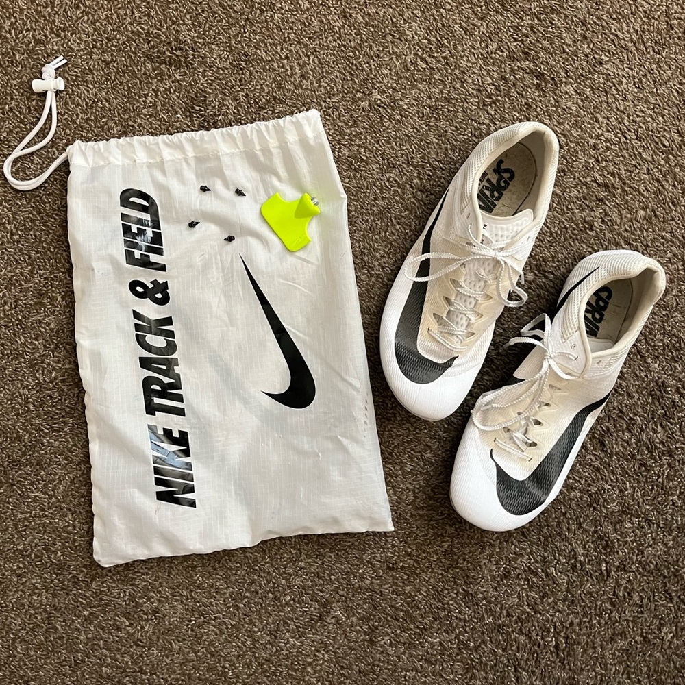 Size 14 Nike Rival Track & Field Cleats. W/ bag. Missing 1 spike. Hardly used.